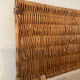 Woven wicker vintage suitcase