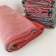 Tablecloth and 12 coral and grey napkins in a retro Scandinavian 1960s style.