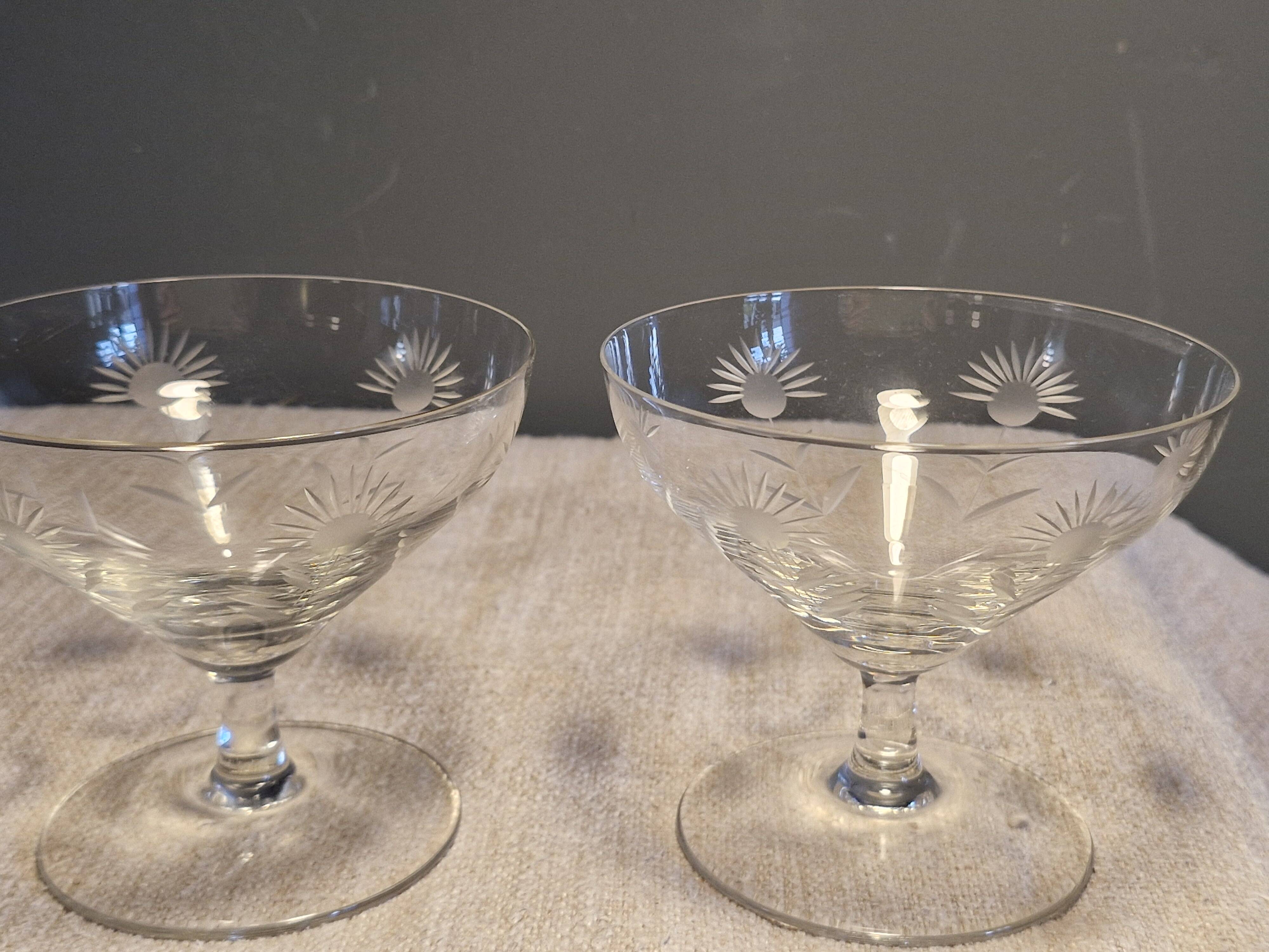 3 antique champagne coupes in engraved crystal with large daisies.