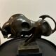 Bronze bull on marble base signed Milo