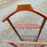 Valet wearing double wood coat rack