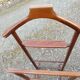 Valet wearing double wood coat rack