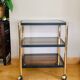 Side table in gold metal and smoked glasses 1970s