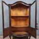 Curved library with two walnut doors, in Louis XV style.