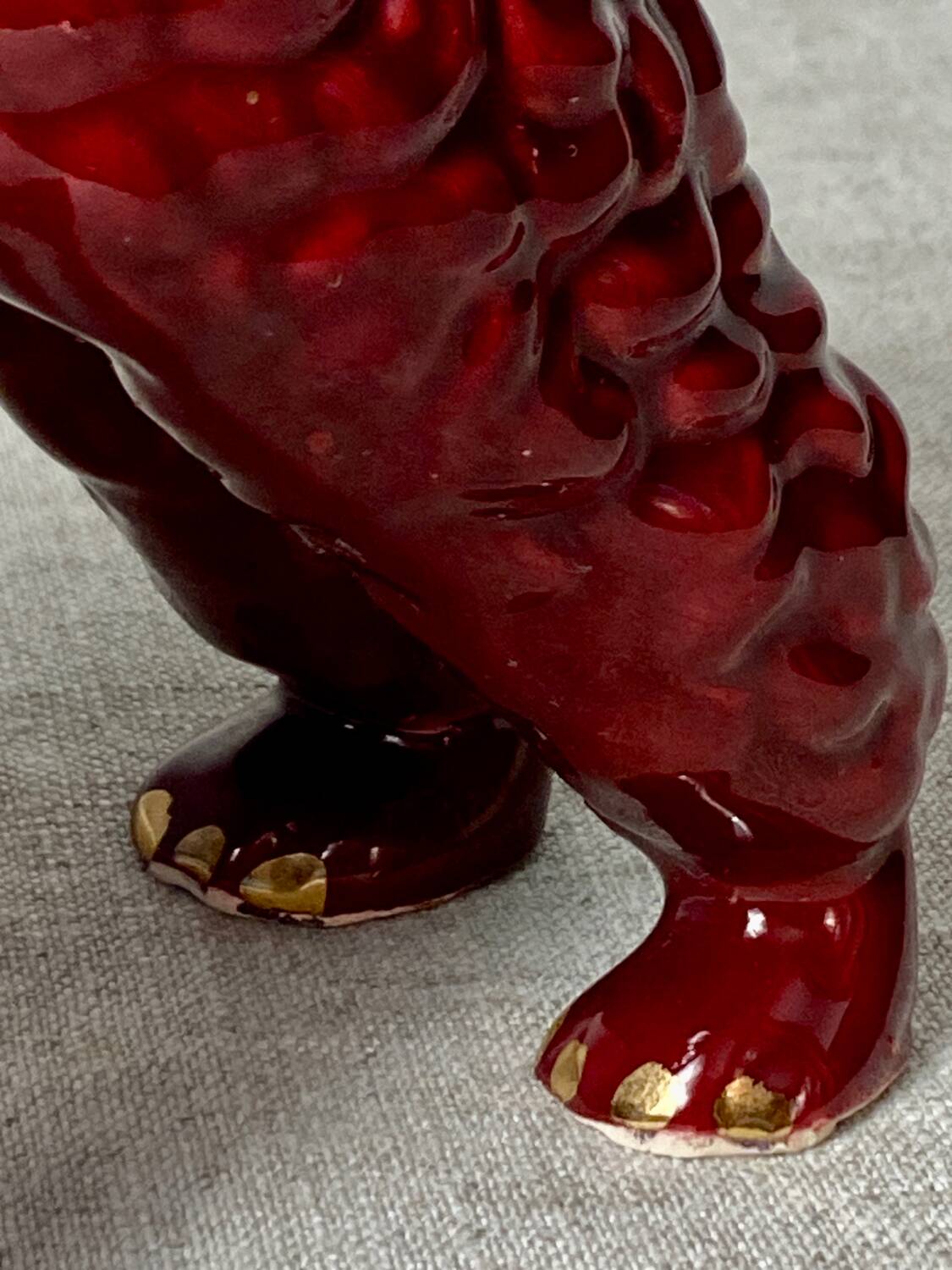 Burgundy and gold ceramic dog