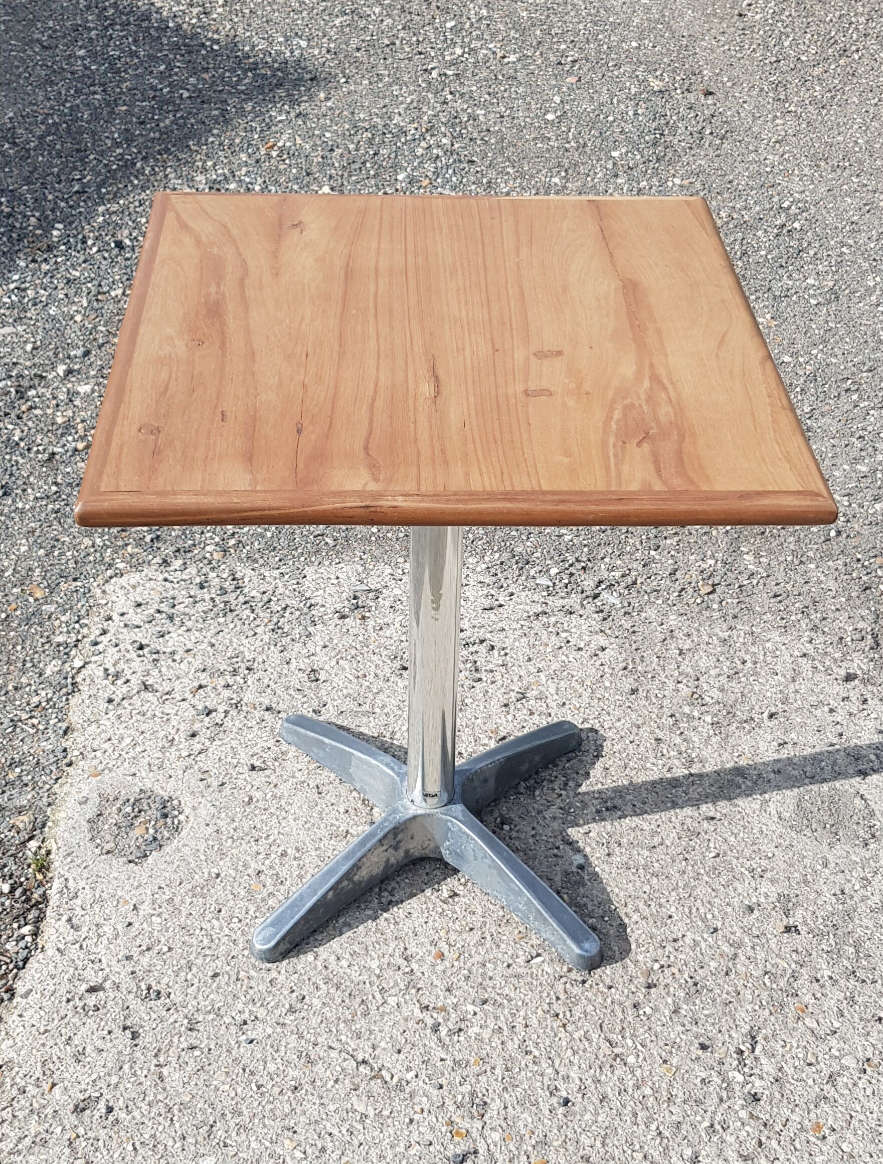Foldable bistro table with teak top and aluminum base