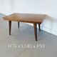 Vintage Scandinavian wooden dining table with tapered legs.