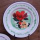 7 printed floral enamel plates "bon voyage" Made in China