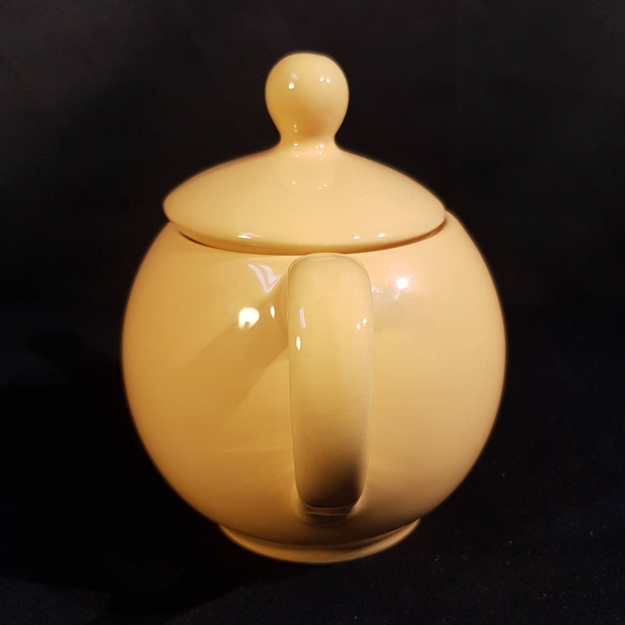Yellow ceramic teapot