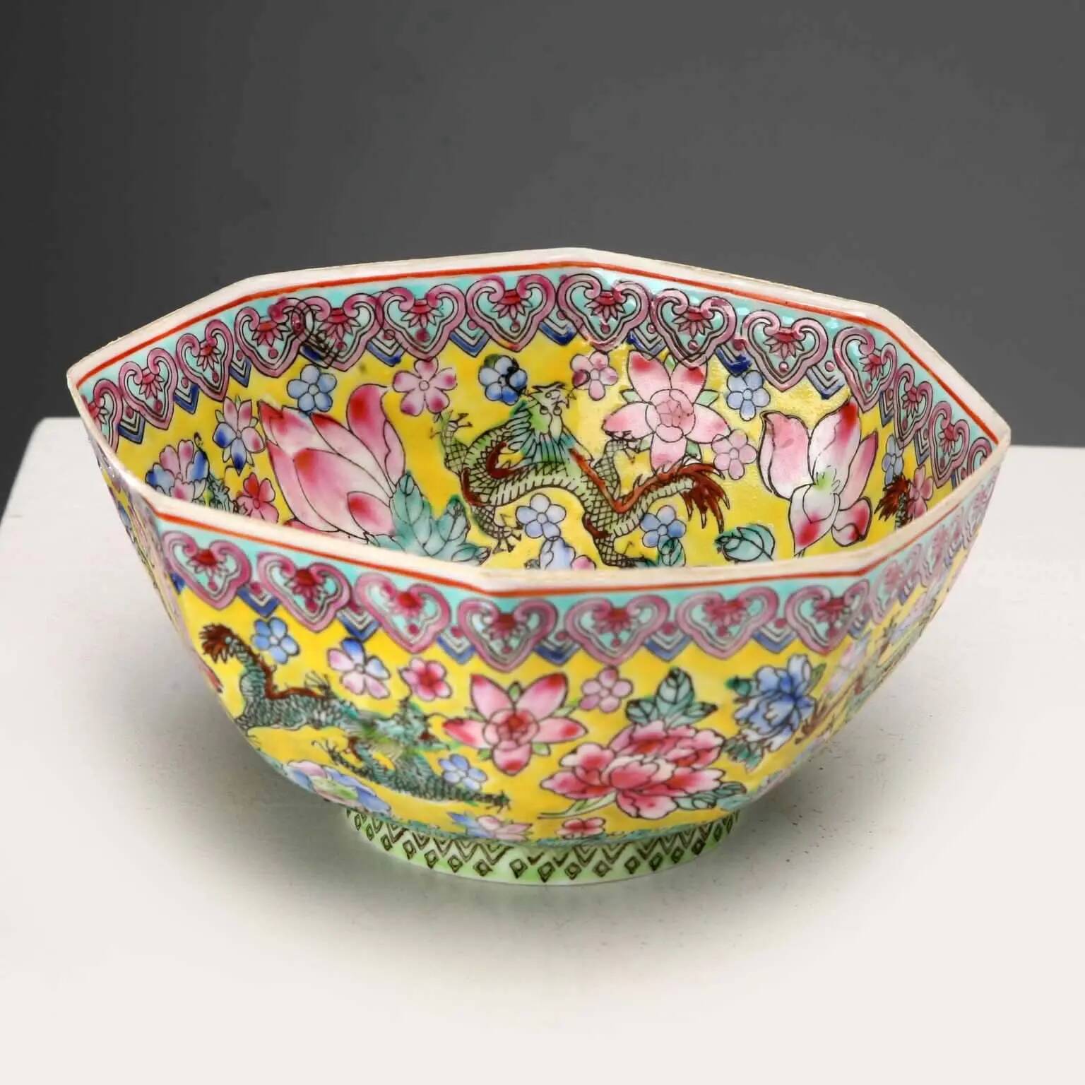Vintage porcelain bowl decorated with dragons and flowers, China, 1980s.