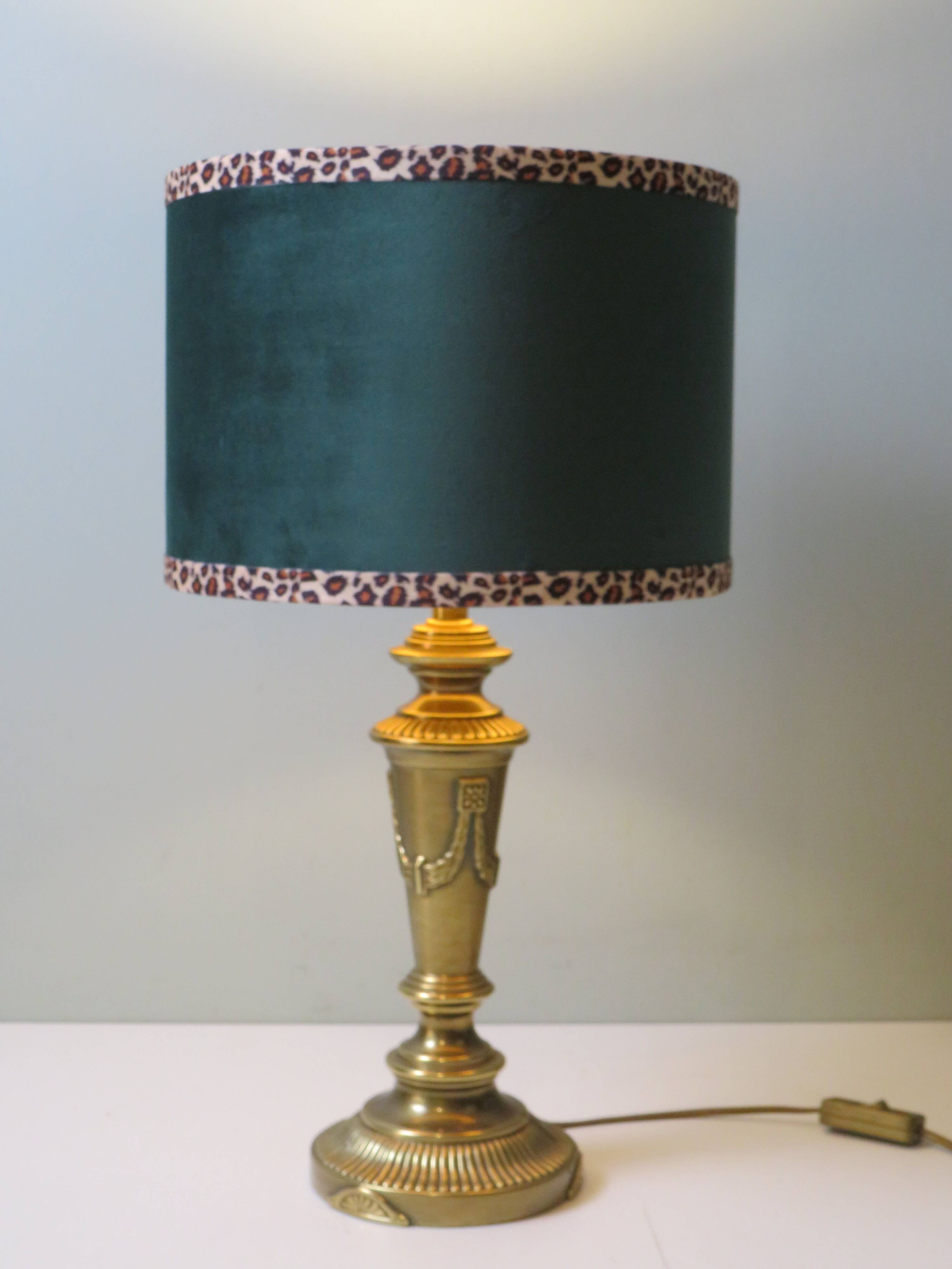 Vintage brass table lamp with green velvet shade.
