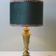 Vintage brass table lamp with green velvet shade.