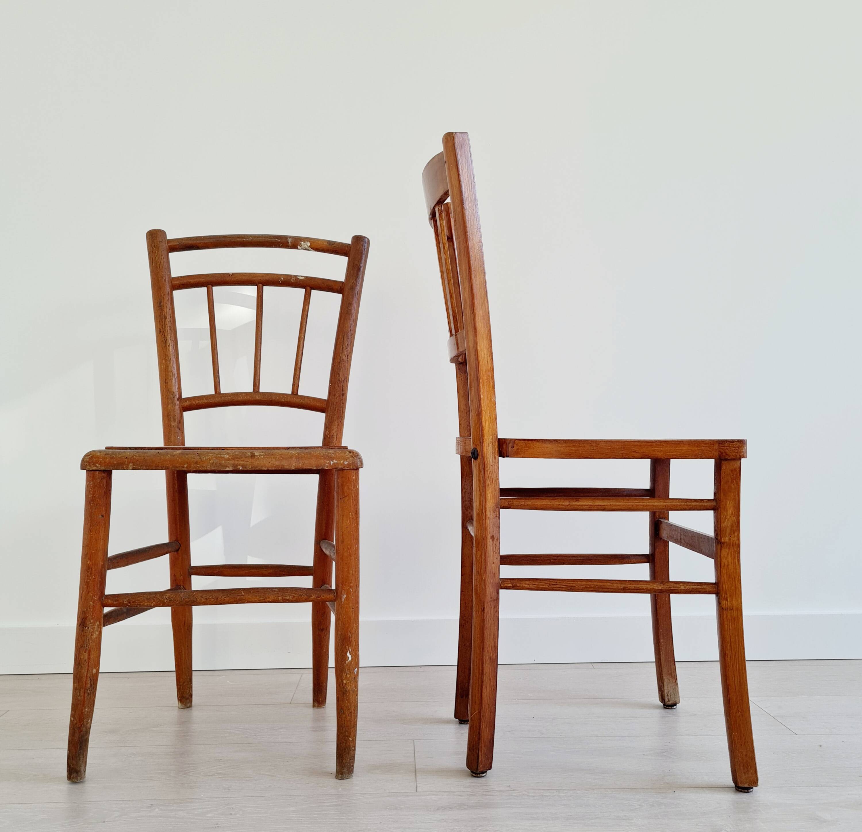 Mismatched wooden bistro chairs