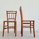 Mismatched wooden bistro chairs