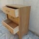 Vintage chest of drawers in raw wood.