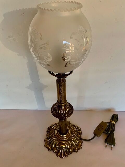 Ancient lamp on foot