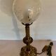 Ancient lamp on foot