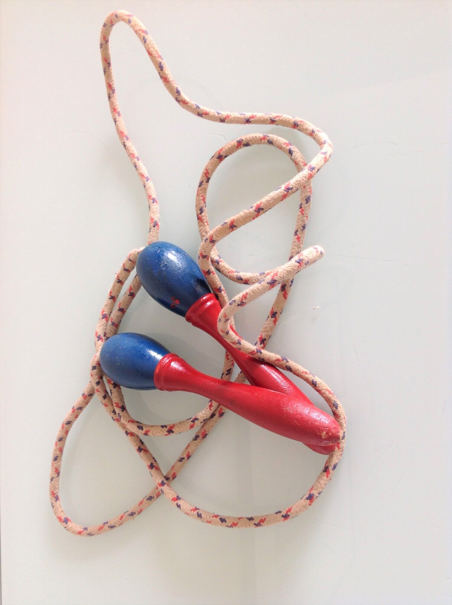 Old wooden jump rope red and blue / vintage