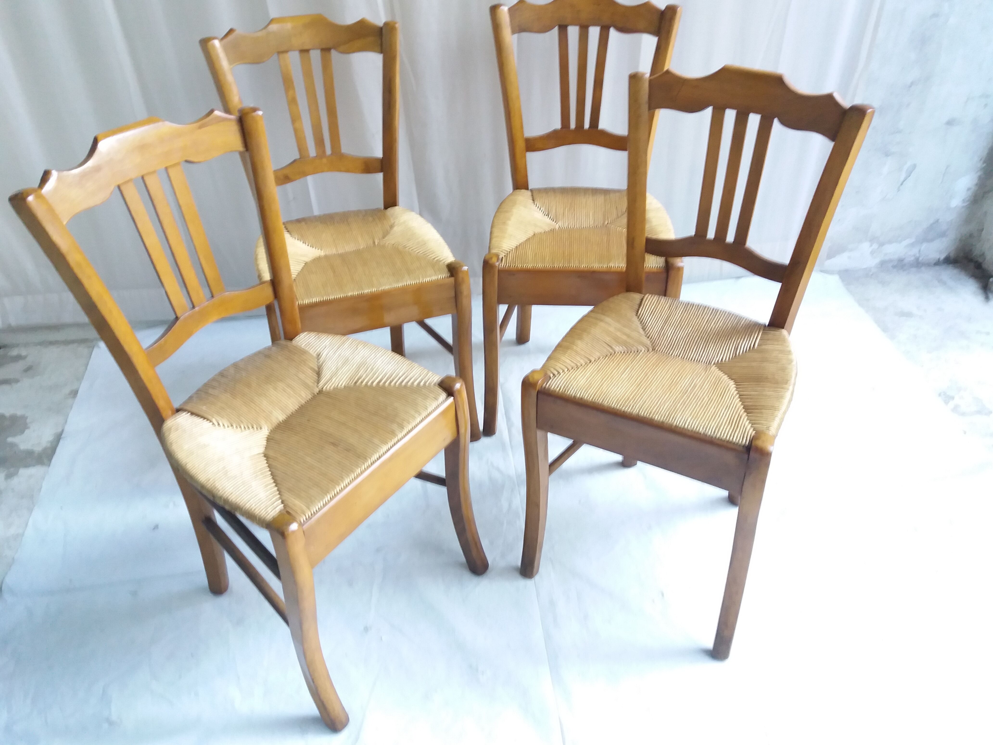 Series of 4 old mulched chairs
