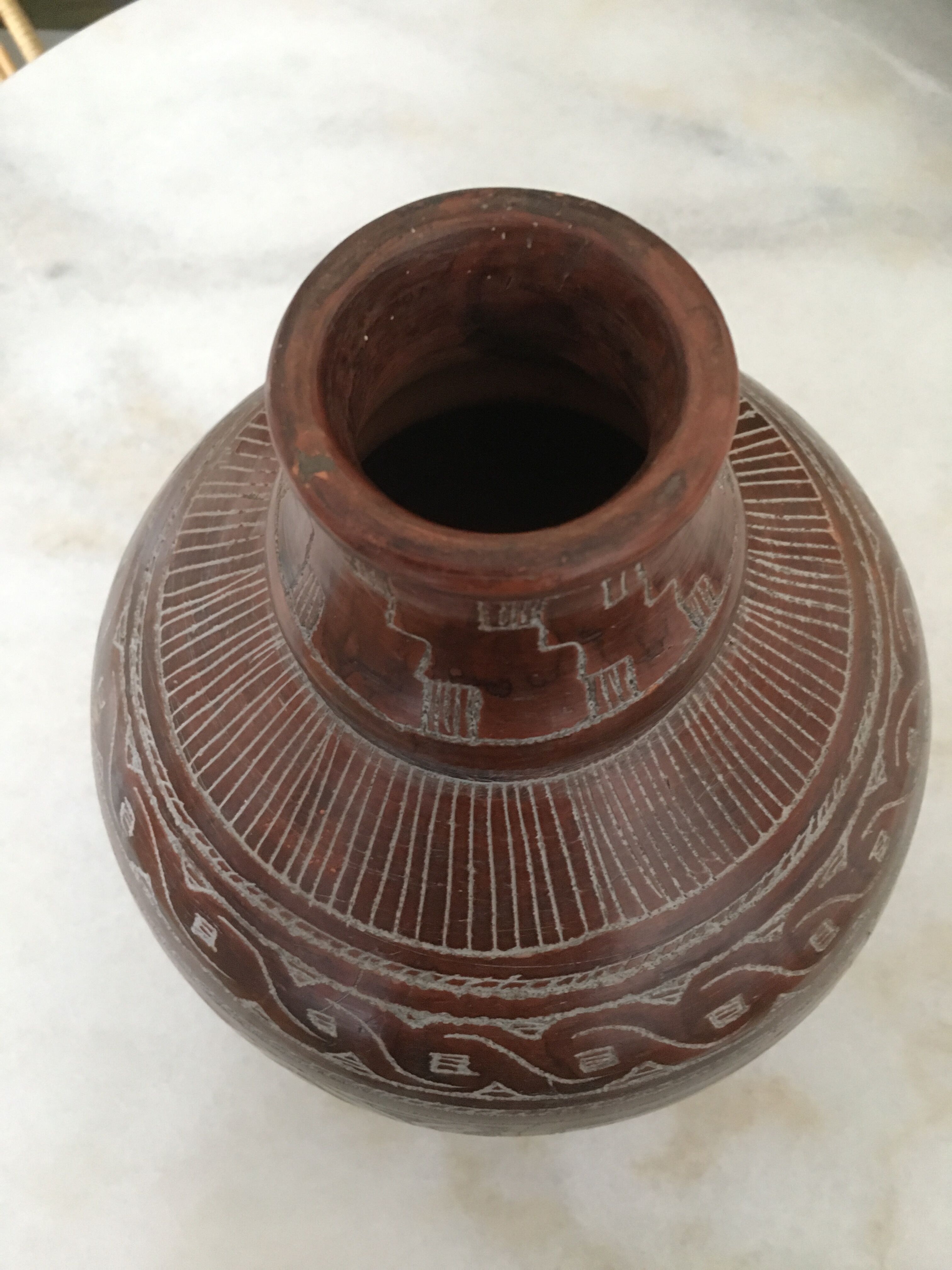 Vase in earth baked ethnic graphic patterns