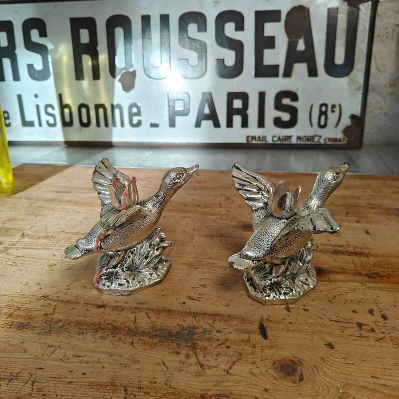 Set of two vintage silver-plated candle holders.