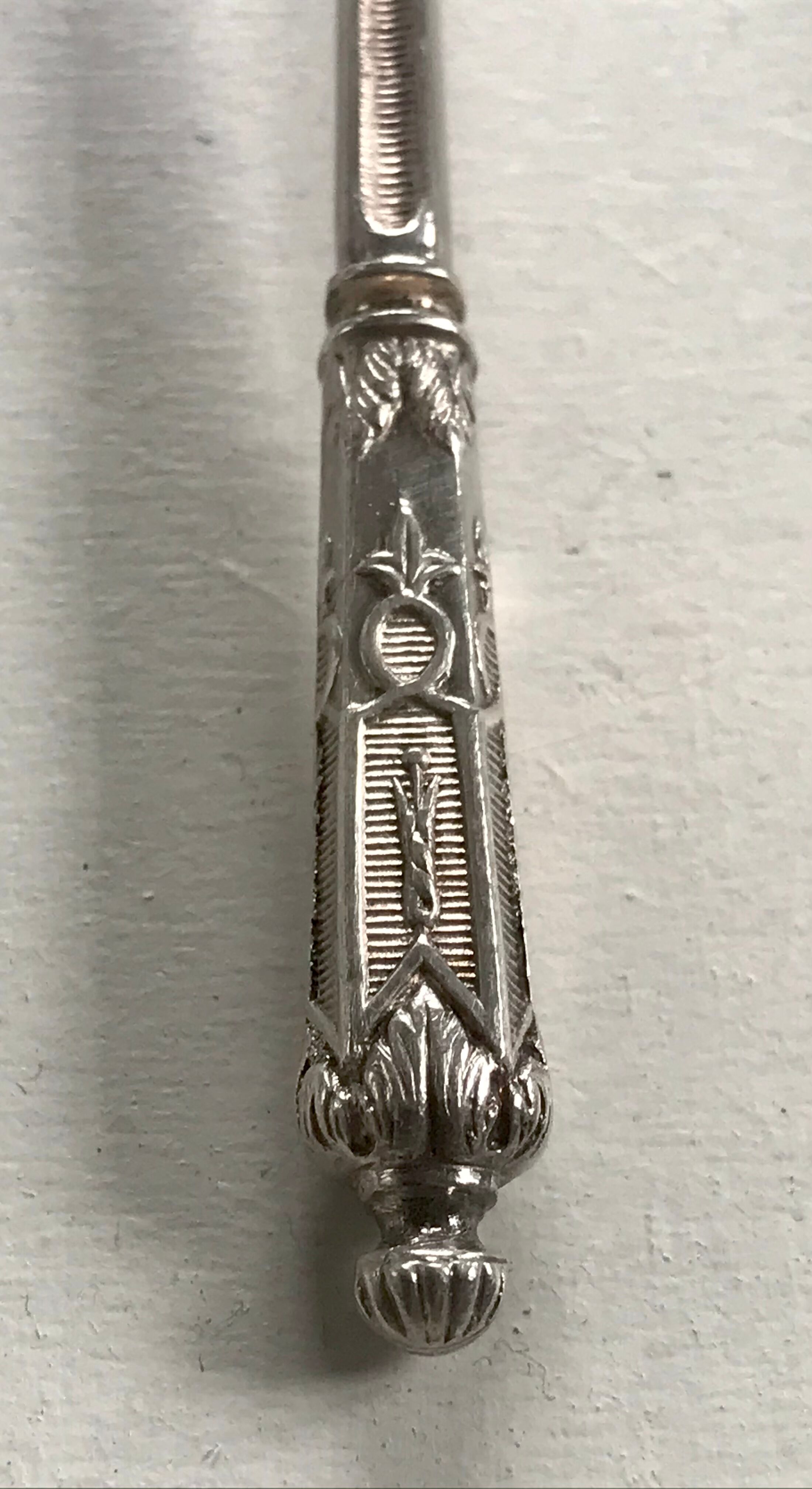 12 teaspoons silver metal