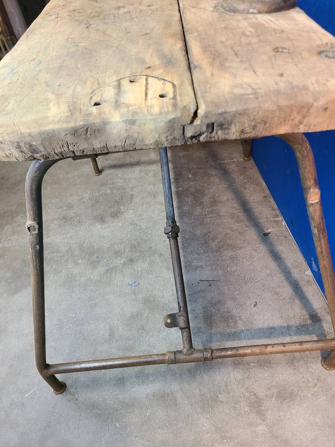 Vintage workbench circa 1930, folding metal leg.