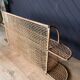 Steel and wicker wall shelf
