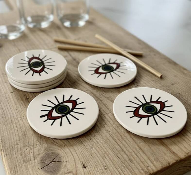 Lot of 6 ethnic ceramic coasters with eye design.
