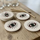 Lot of 6 ethnic ceramic coasters with eye design.