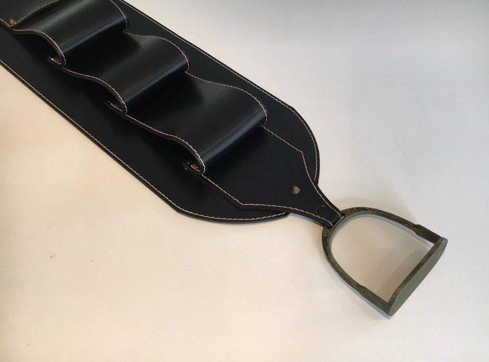 Leather wall-mounted magazine rack. Attributed to Jacques Adnet