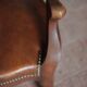 Barber chair in wood and leather with adjustable headrest, office chair.