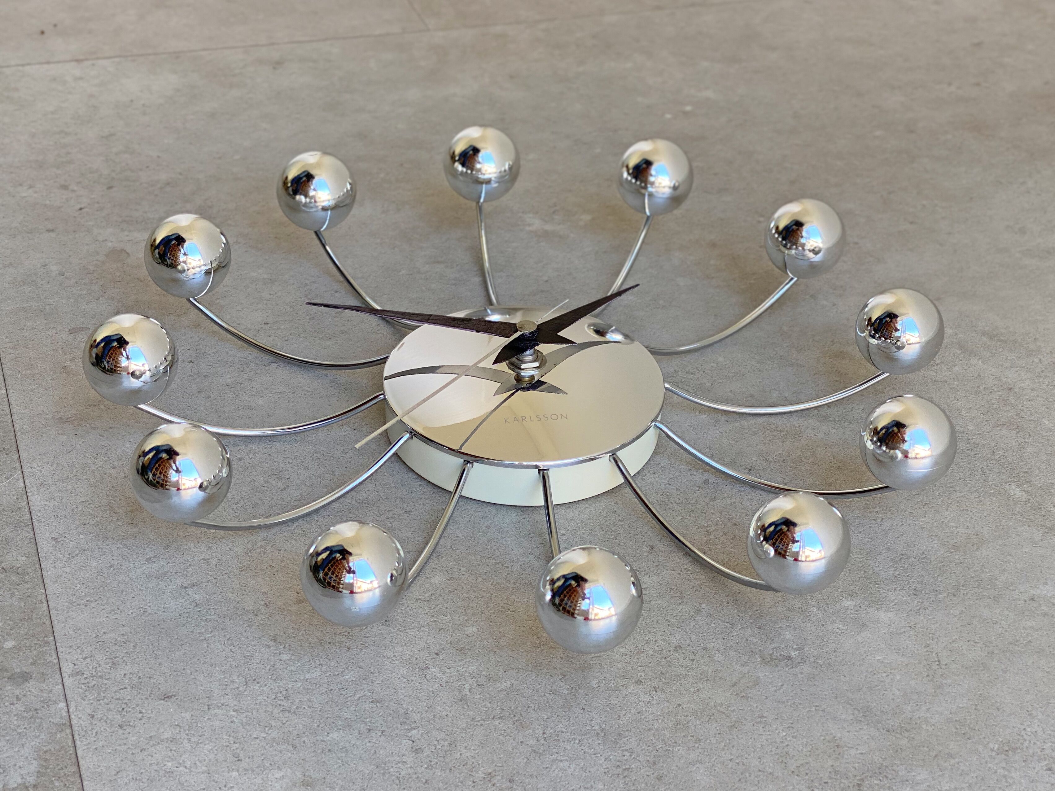 Chrome Karlsson spider wall clock with black hands, sputnik space age