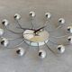 Chrome Karlsson spider wall clock with black hands, sputnik space age