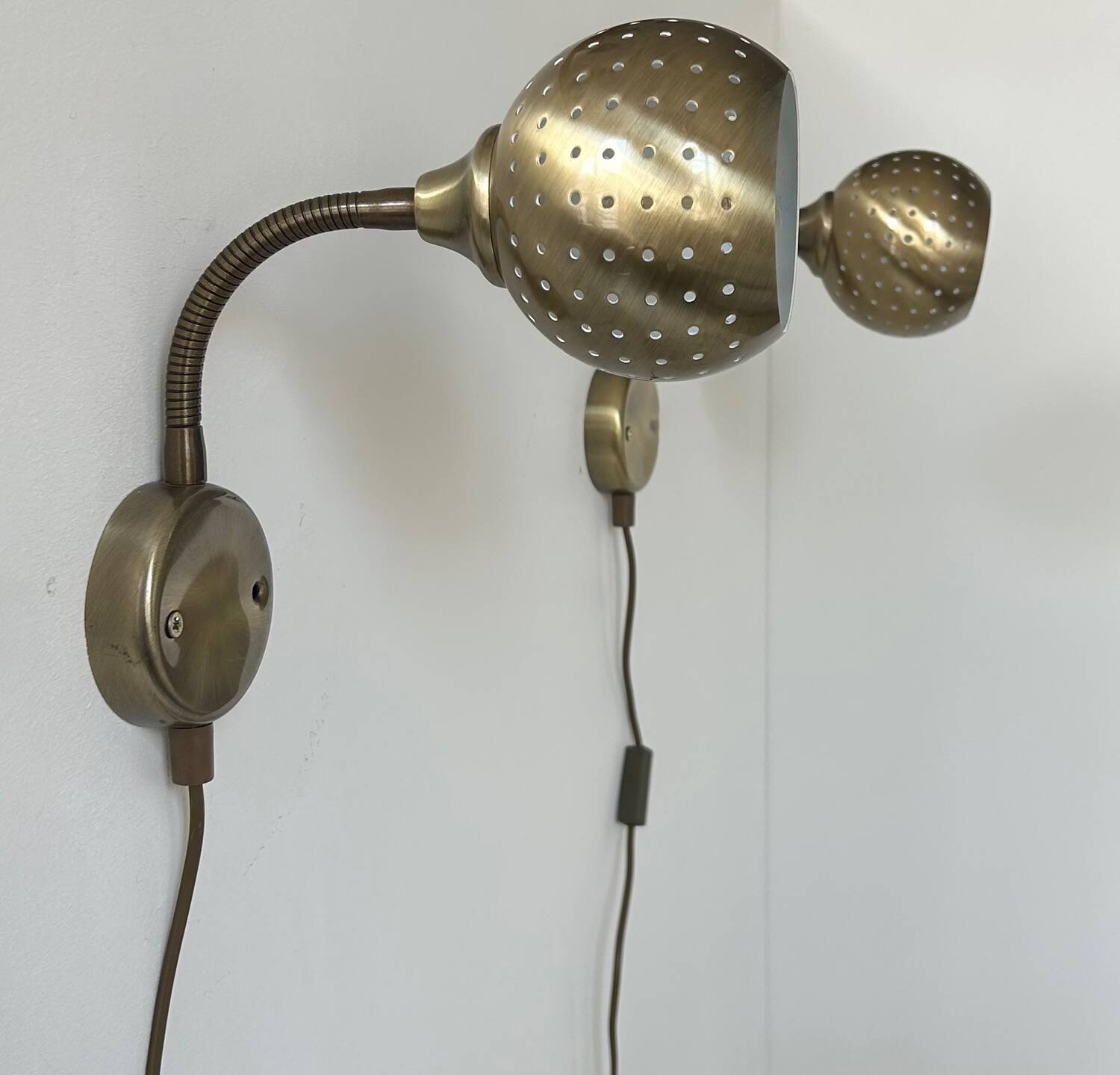 Pair of vintage adjustable wall lights, perforated brass, Sweden 1960