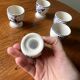 Set of 4 vintage egg cups and salt shaker in blue Delft pottery.
