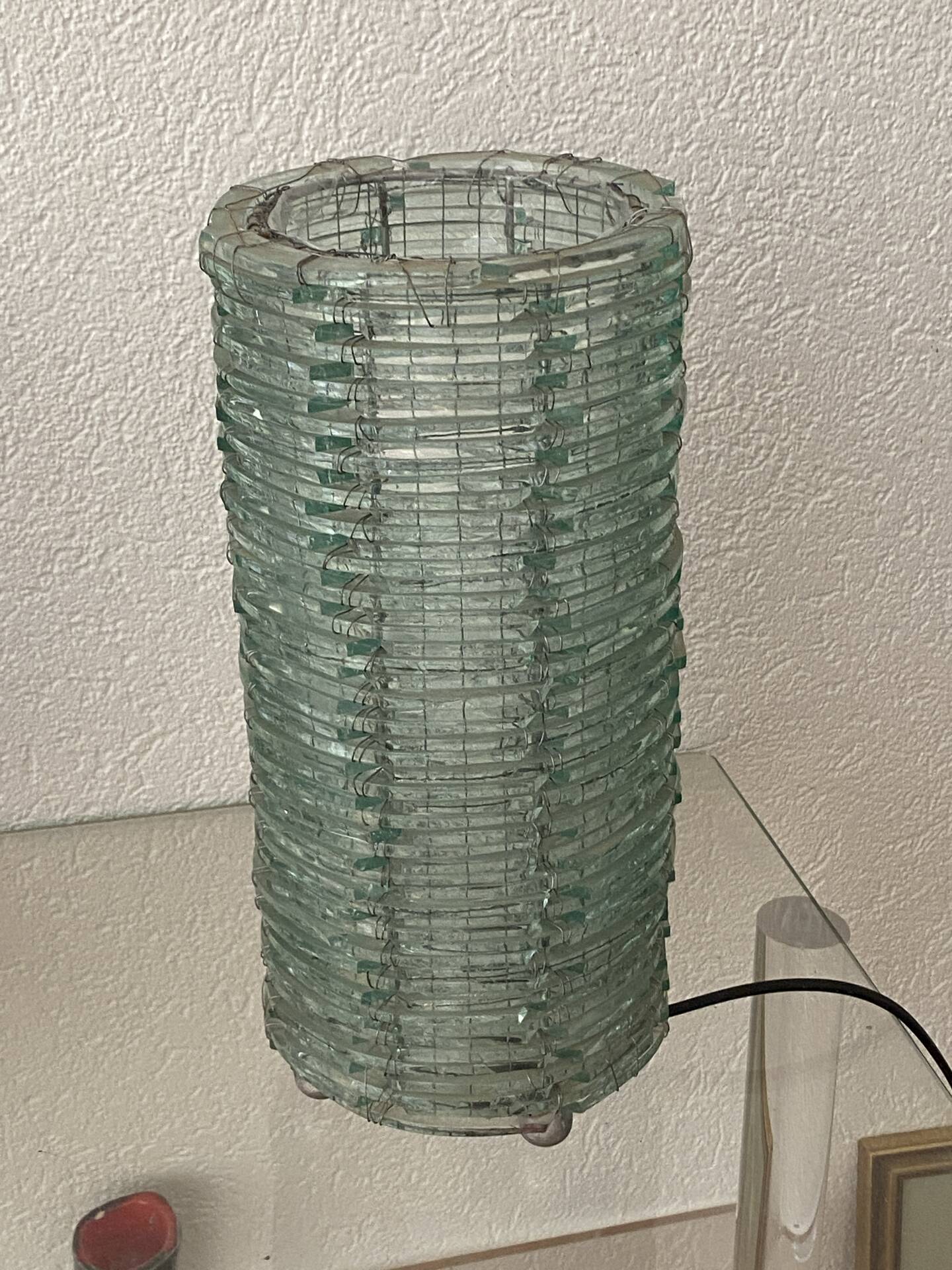 Blue-tinted glass lamp and wire.