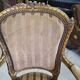 Paire de fauteuils en bois dore style Louis XVl