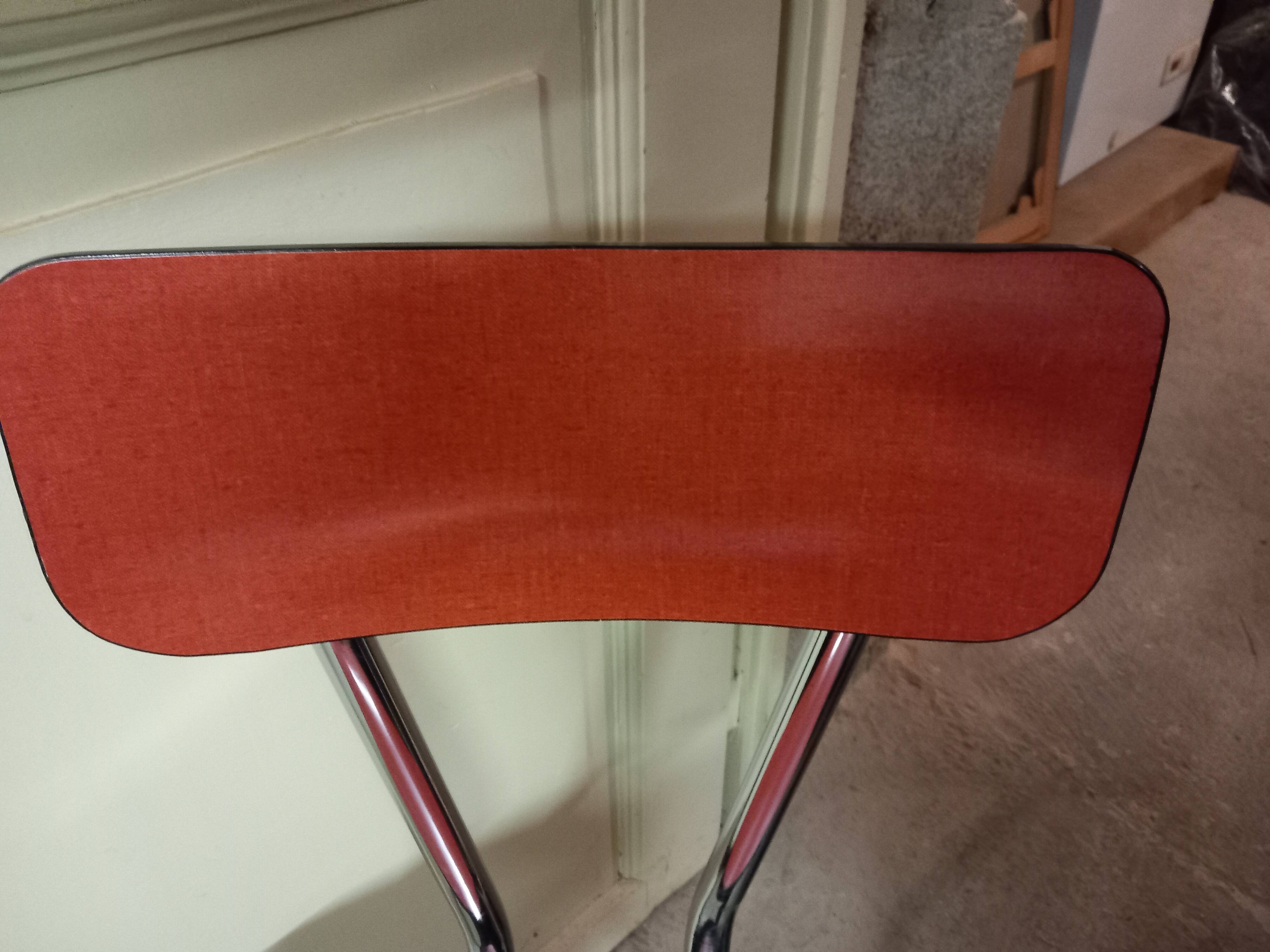 4 red formica chairs