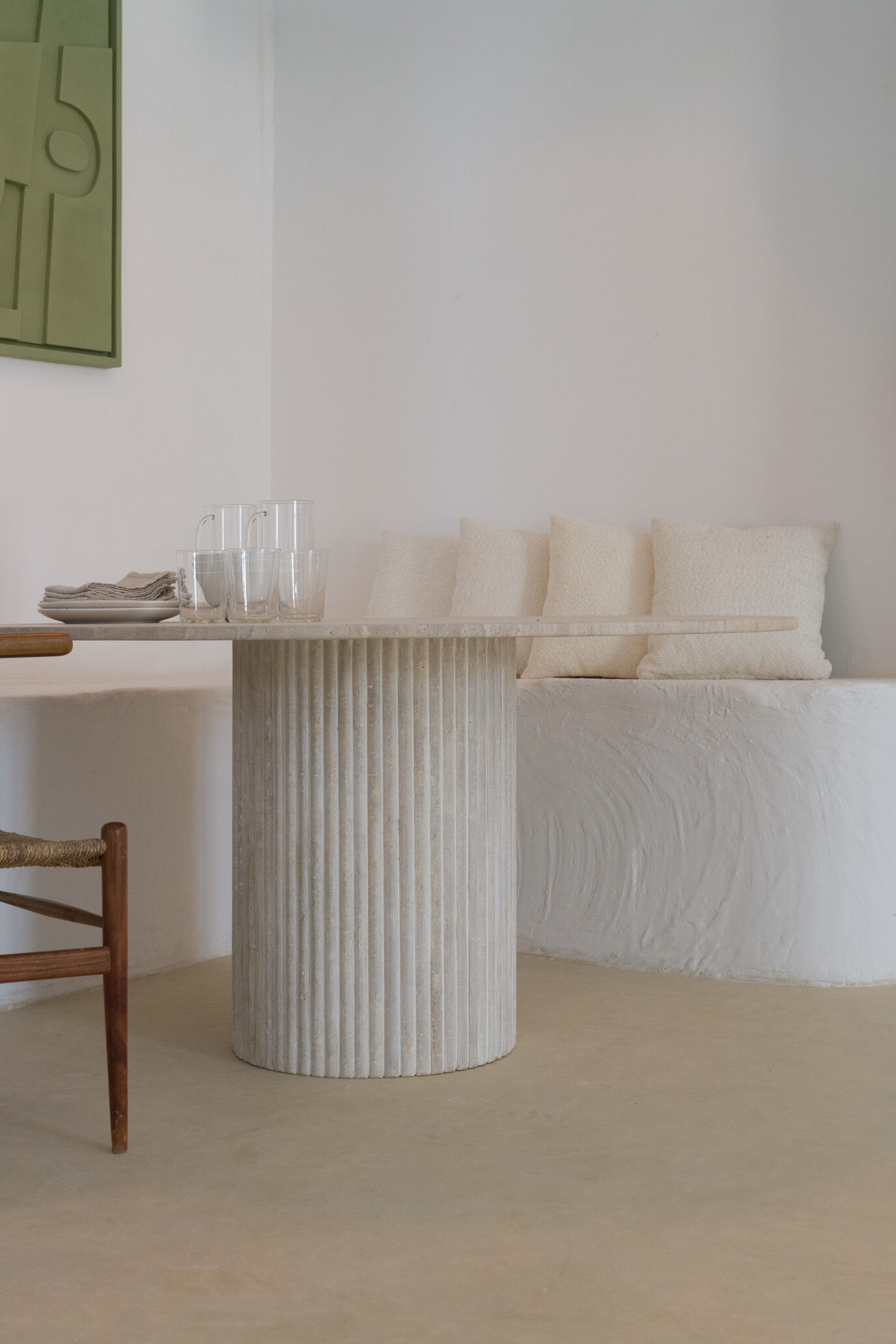 Omega circular dining table in natural travertine