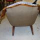 Relaxed Voltaire armchair with walnut racks