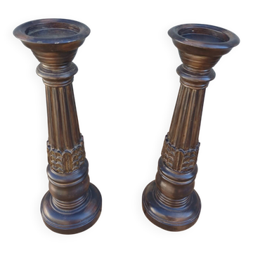 2 carved wooden candlesticks