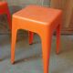 Pair of AMI stools in orange plastic