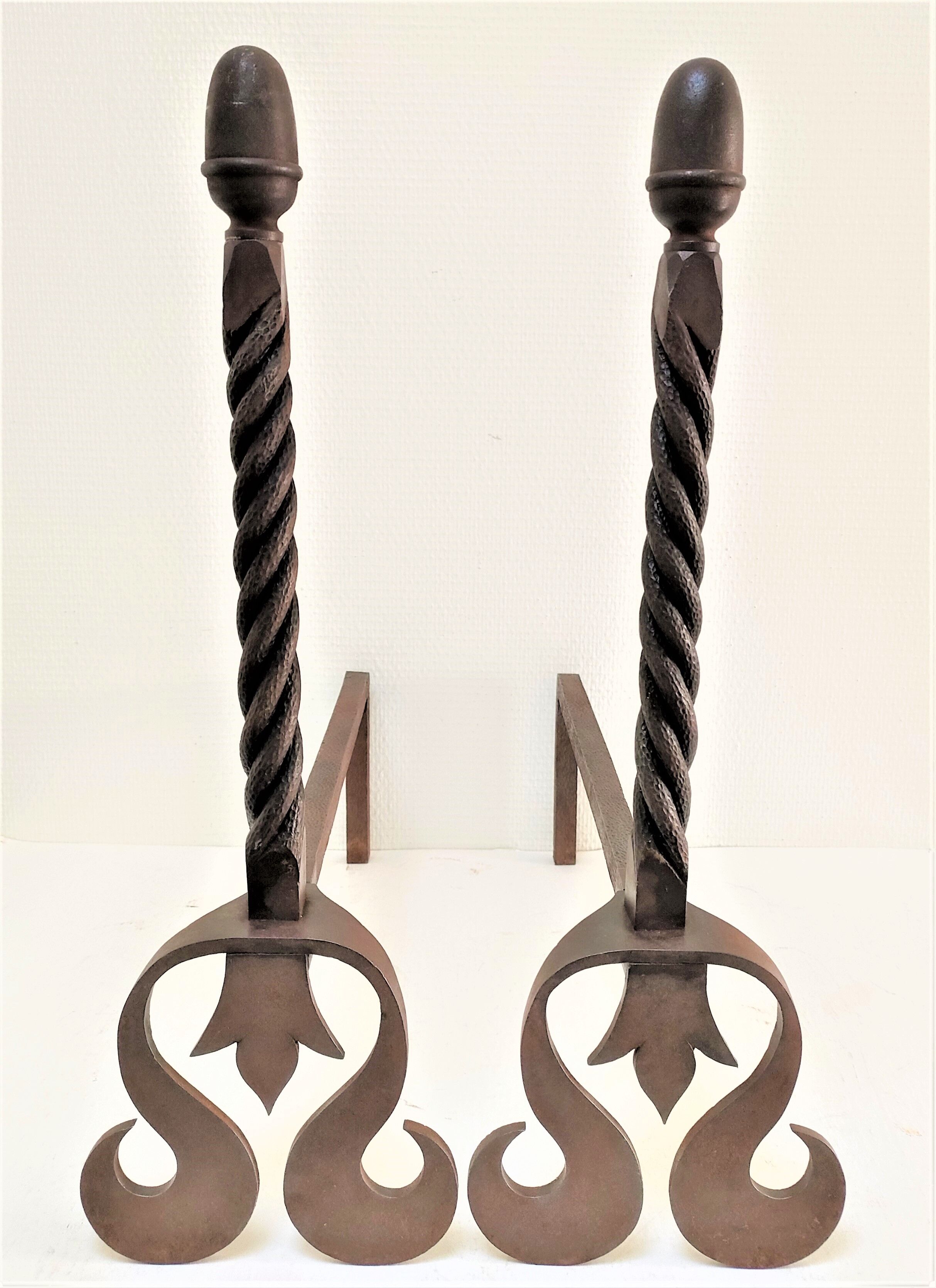 Pair of sculptural cast iron chenets with twisted heads