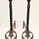 Pair of sculptural cast iron chenets with twisted heads