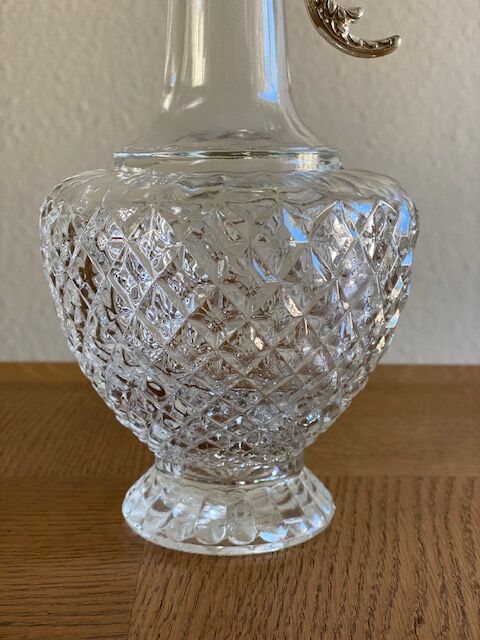 Glass and silver metal ewer