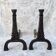 Pair of Art Deco cast iron andirons