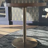 Round wooden and brass table