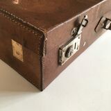 Suitcase of leather with labels of palaces