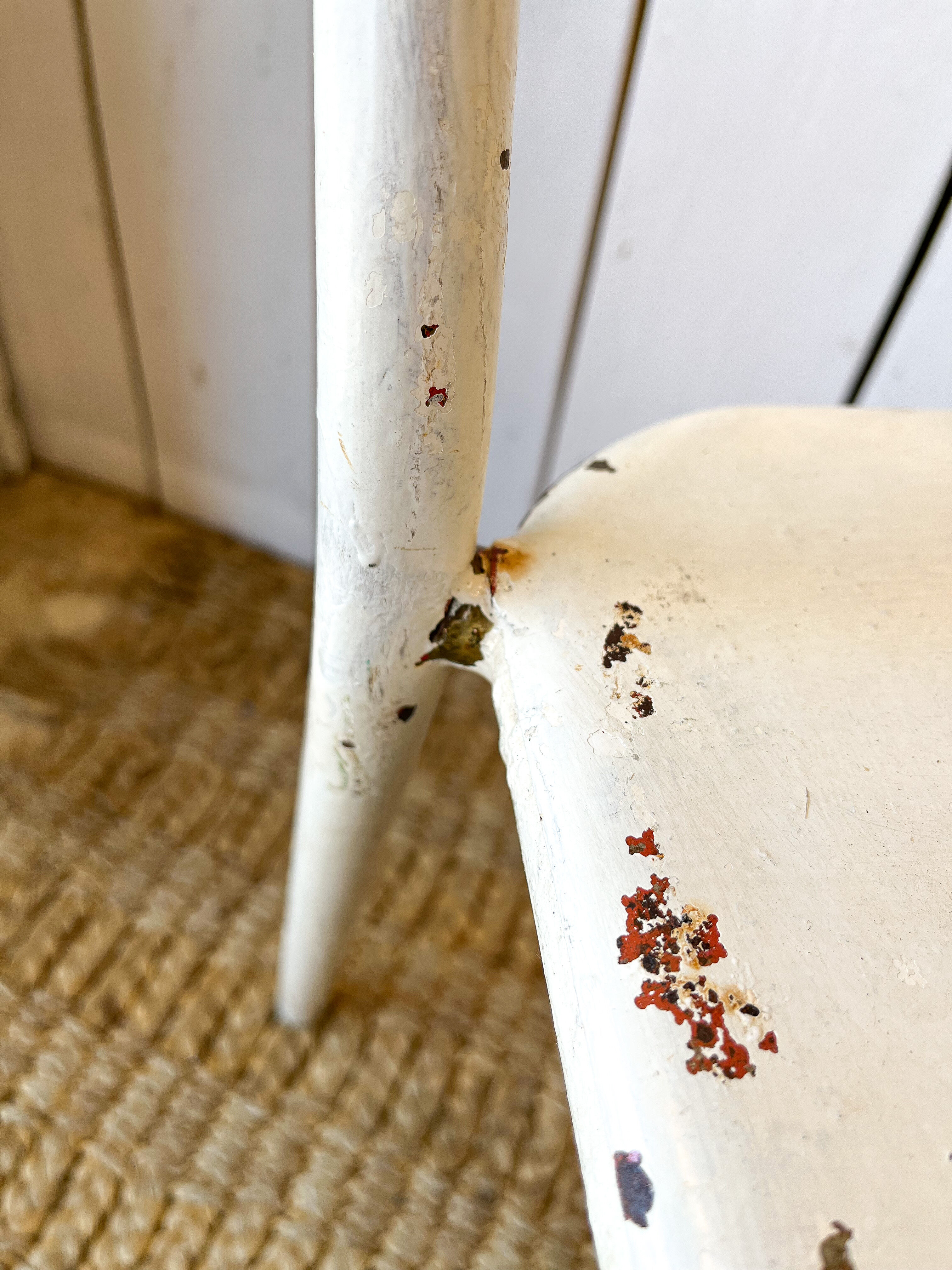 Pair of white metal bistro chairs